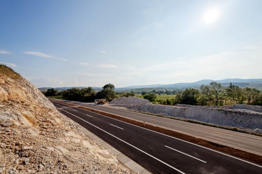 New asphalt road on a sunny day in rural area	