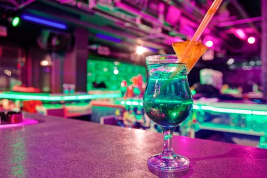 cocktail at bar in a night club with vivid colors