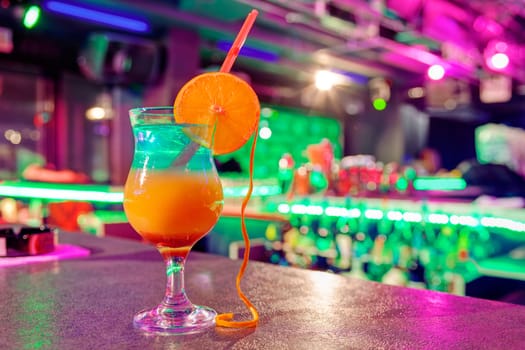 Close up of cocktail at the bar in a night club with vivid colors