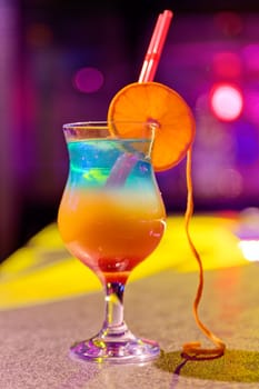 Close up of cocktail at the bar in a night club with vivid colors