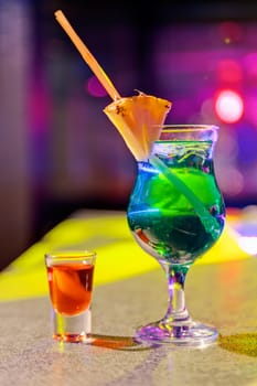 cocktail at bar in a night club with vivid colors