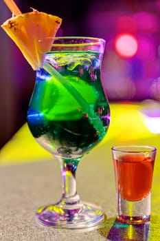 cocktail at bar in a night club with vivid colors