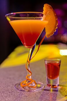 cocktail at bar in a night club with vivid colors