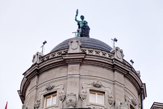 Details of stone facade with ornaments and statues