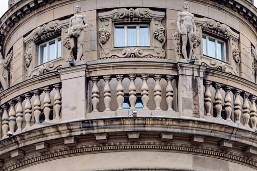 Details of stone facade with ornaments and statues