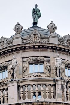 Details of stone facade with ornaments and statues