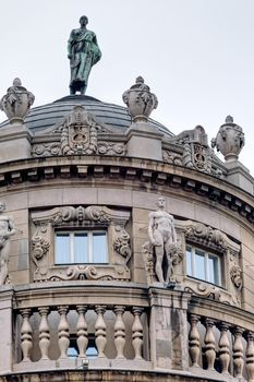 Details of stone facade with ornaments and statues