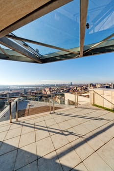 Terrace with metal and glass construction in modern building