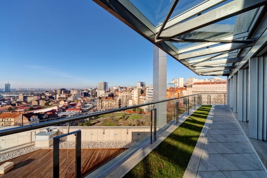 Terrace with metal and glass construction in modern building