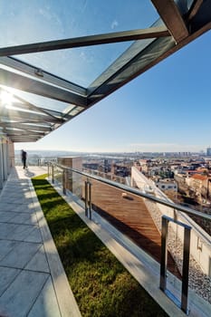 Terrace with metal and glass construction in modern building