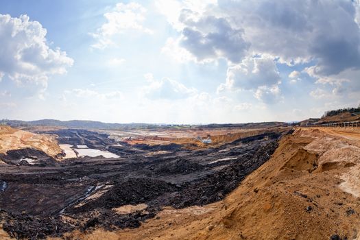 open mining pit with heavy machinery