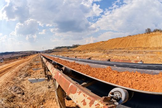 open mining pit with heavy machinery