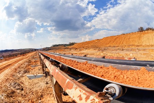 open coal mining pit with heavy machinery