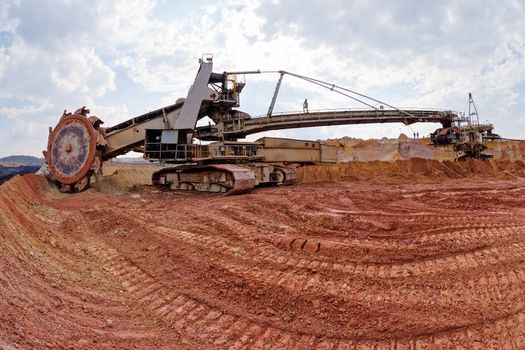 open mining pit with heavy machinery