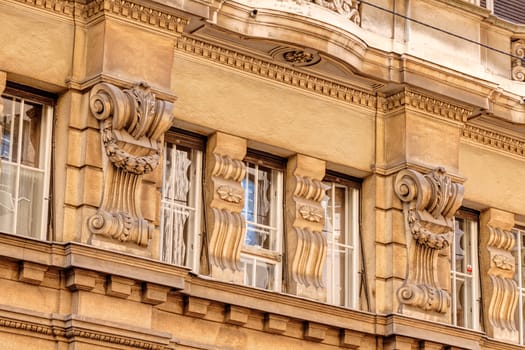 stone facade on classical building with ornaments and sculptures