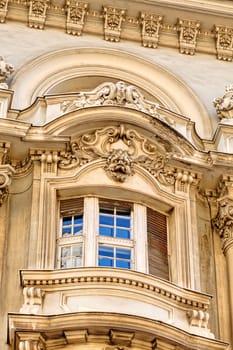 stone facade on classical building with ornaments and sculptures