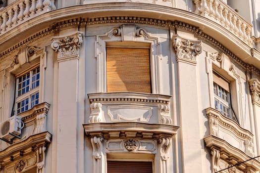 stone facade on classical building with ornaments and sculptures