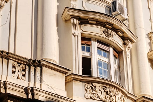 stone facade on classical building with ornaments and sculptures