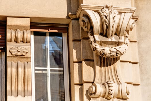 stone facade on classical building with ornaments and sculptures