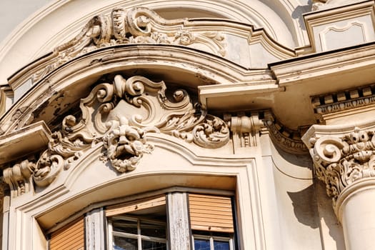 stone facade on classical building with ornaments and sculptures