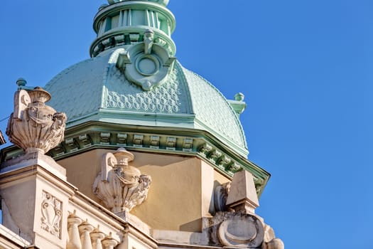 Stone facade on classical building with ornaments and sculptures