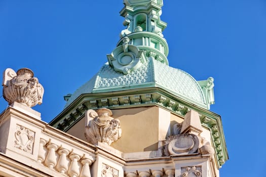 Stone facade on classical building with ornaments and sculptures