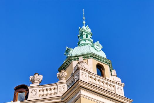 Stone facade on classical building with ornaments and sculptures