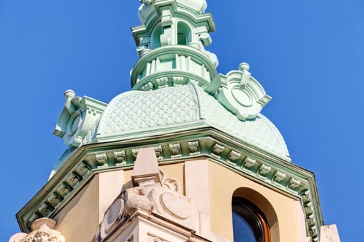 Stone facade on classical building with ornaments and sculptures