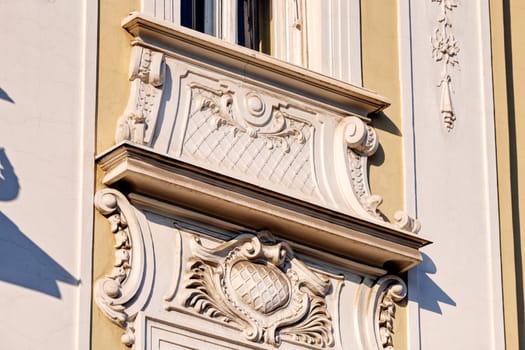stone facade on classical building with ornaments and sculptures