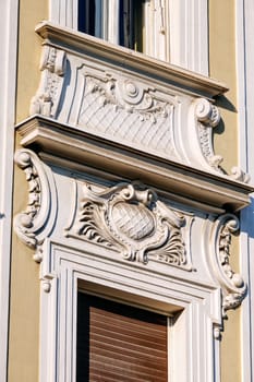 stone facade on classical building with ornaments and sculptures