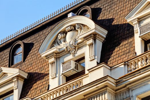 stone facade on classical building with ornaments and sculptures