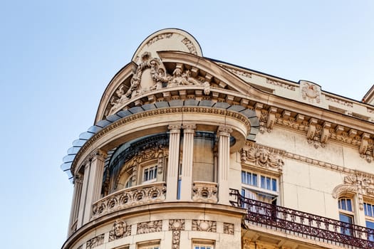 stone facade on classical building with ornaments and sculptures