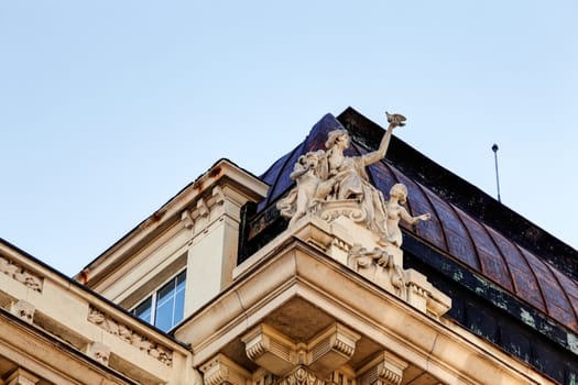 stone facade on classical building with ornaments and sculptures