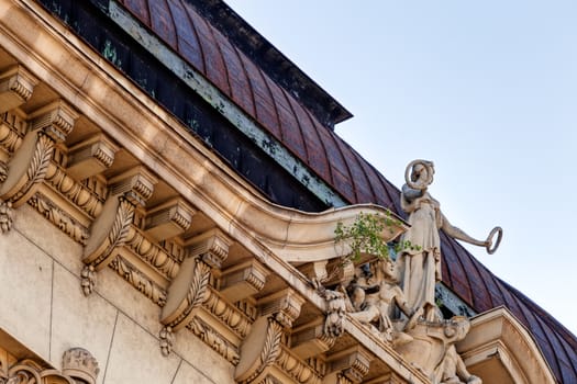 stone facade on classical building with ornaments and sculptures