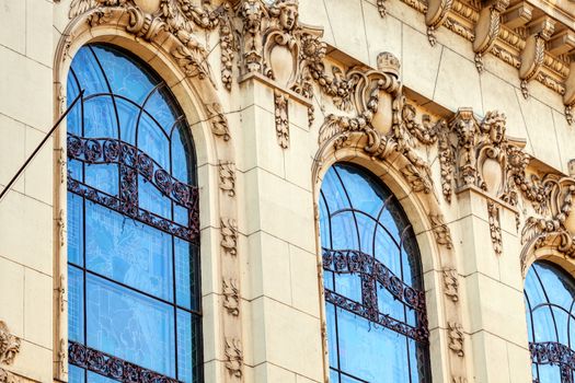 stone facade on classical building with ornaments and sculptures