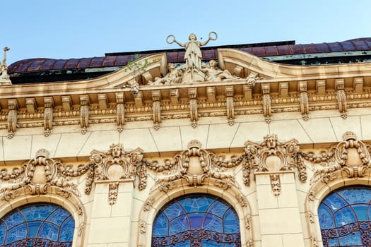 stone facade on classical building with ornaments and sculptures