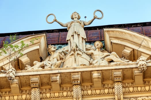 stone facade on classical building with ornaments and sculptures