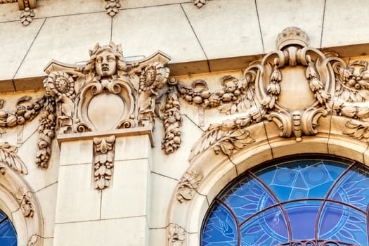 stone facade on classical building with ornaments and sculptures