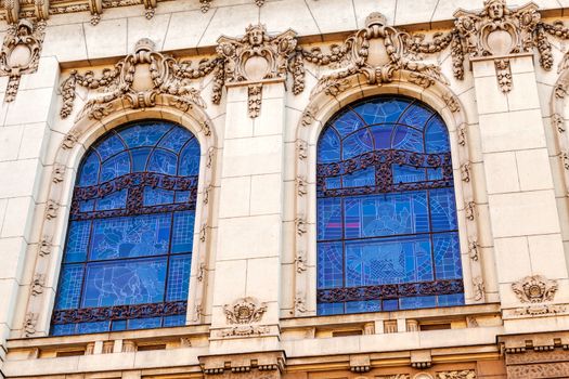 stone facade on classical building with ornaments and sculptures