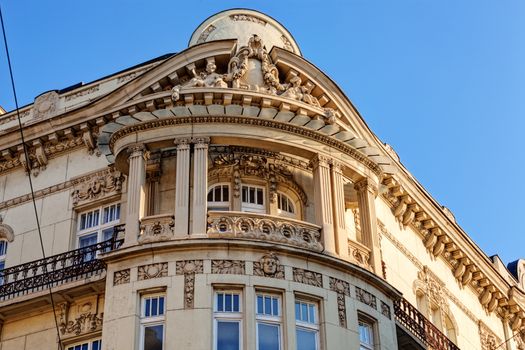 stone facade on classical building with ornaments and sculptures