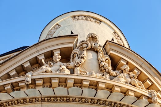 stone facade on classical building with ornaments and sculptures