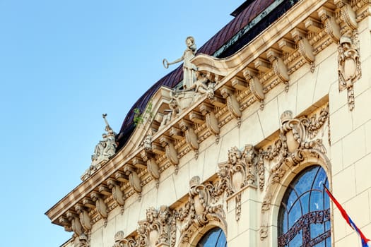 stone facade on classical building with ornaments and sculptures