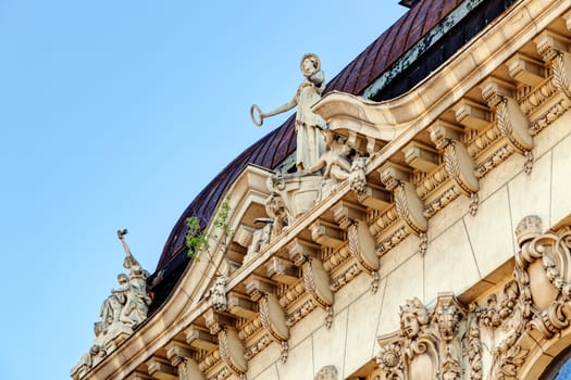 stone facade on classical building with ornaments and sculptures