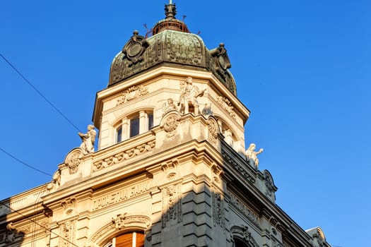 stone facade on classical building with ornaments and sculptures