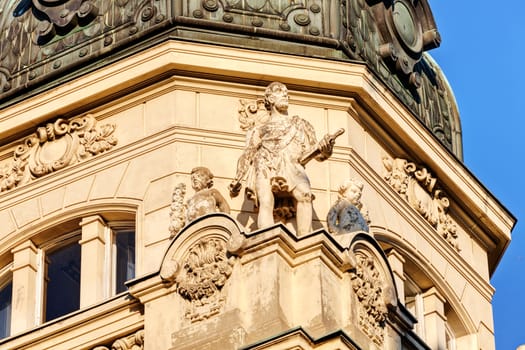 stone facade on classical building with ornaments and sculptures