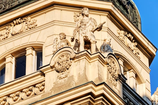 stone facade on classical building with ornaments and sculptures