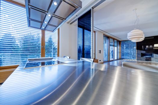 Modern kitchen interior with stainless steel sink and appliances