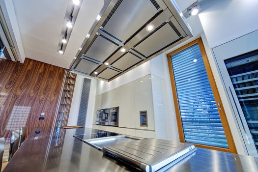 Modern kitchen interior with stainless steel sink and appliances