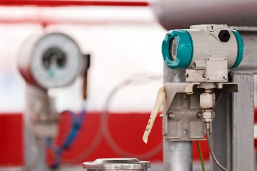 detail of oil pipeline with valves in large oil refinery