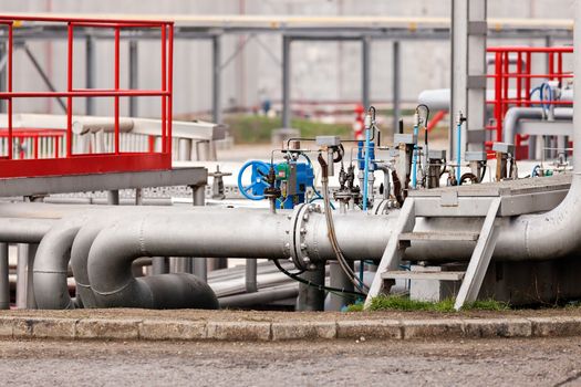 detail of oil pipeline with valves in large oil refinery